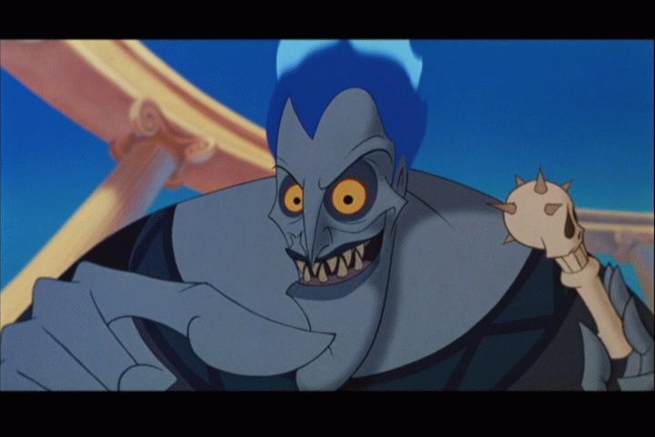 [Image: Hades_holding_a_skull_pacifier_before_at..._mouth.jpg]