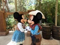 Disneyland Mickey and Minnie kiss as cowboys